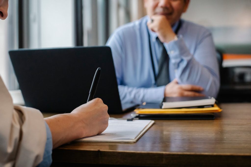 Confidential business sale documents being reviewed professionally
